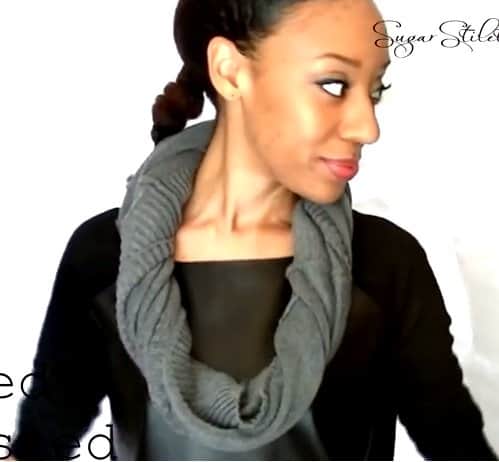 Shaina Glenn gives the infinity scarf some texture by twisting it around as it is worn around the neck