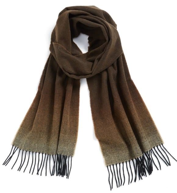 A classic plaid patterns an ultrasoft scarf edged with fringe