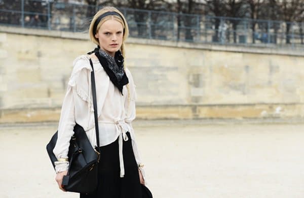 Hanne Gaby Odiele wears her frilly, flowy, and feminine blouse with a printed scarf
