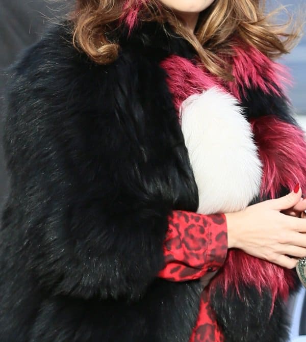Kelly Brook wears two doses of fur to keep herself warm in the cold London winter weather