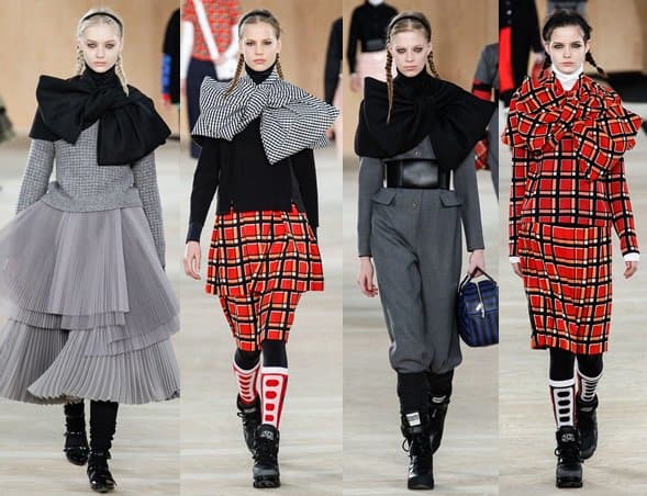 Models wear stiff large bow-detailed capes with their MBMJ outfits