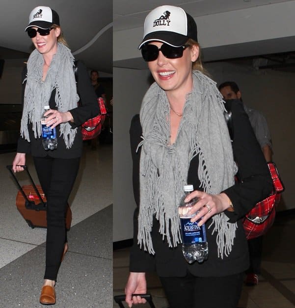 Katherine Heigl tries to stay incognito with Minnie Rose‘s cashmere shawl as she arrives at LAX