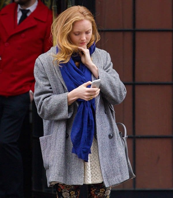 Lily Cole wears a gorgeous bright blue scarf in the East Village of New York City
