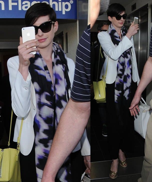 Anne Hathaway shoots a video as she lands in LAX after a flight from Florida