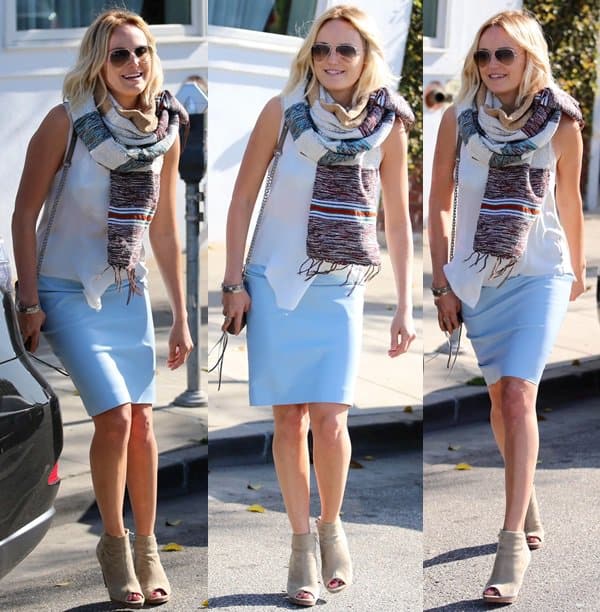 Malin Akerman shows how a classic white tank top can be paired with a pastel blue skirt and a scarf