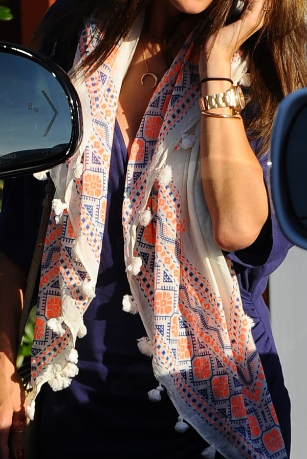 Alessandra Ambrosio accessorizes her classic blue dress with a patterned pompom detailed scarf