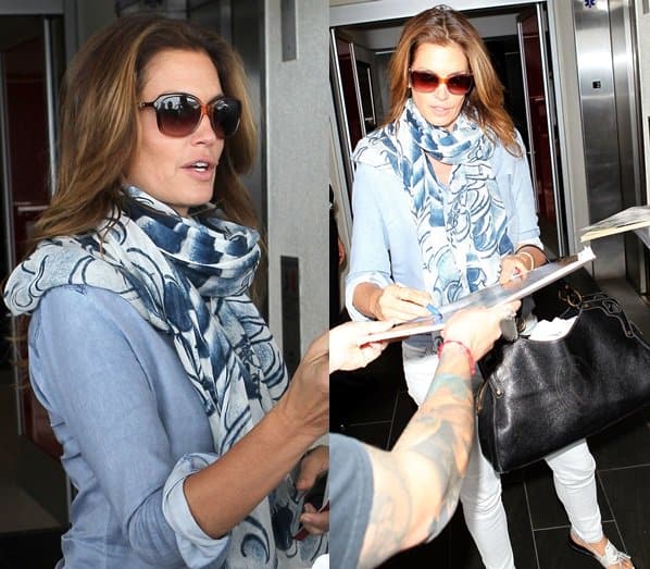Cindy Crawford signs autographs after arriving at LAX
