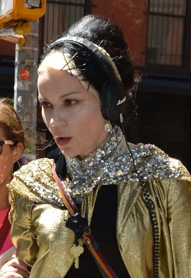 Daphne Guinness wearing a sequined scarf wrapped around her neck