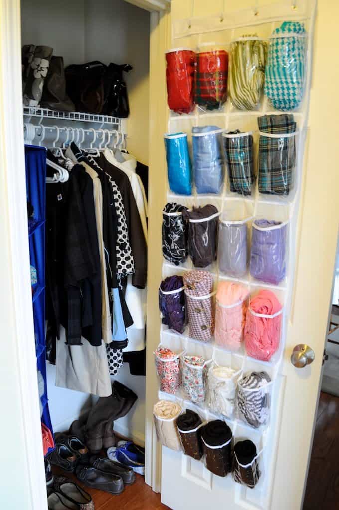 If you're on a budget, grab a behind-the-door clear plastic organizer that's meant for shoes, and use it for scarf storage instead