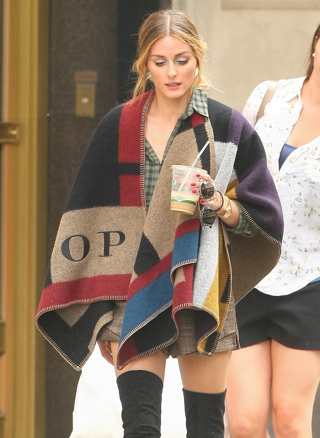 Olivia Palermo shows how to wear a Burberry color-block check blanket poncho