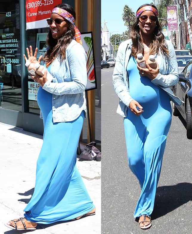 Kelly Rowland is stunning in a bright blue maxi dress paired with studded flat strappy sandals, a light blue chambray shirt, and a vibrantly printed bandanna adding a touch of bohemian flair to her ensemble
