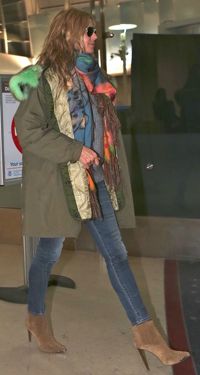 Heidi Klum looks super chic in her scarf-styled getup as she arrives at LAX Airport