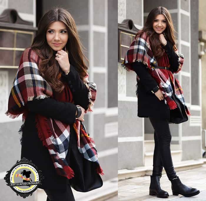 Larisa spiced up a classic all-black attire with a tartan wrap